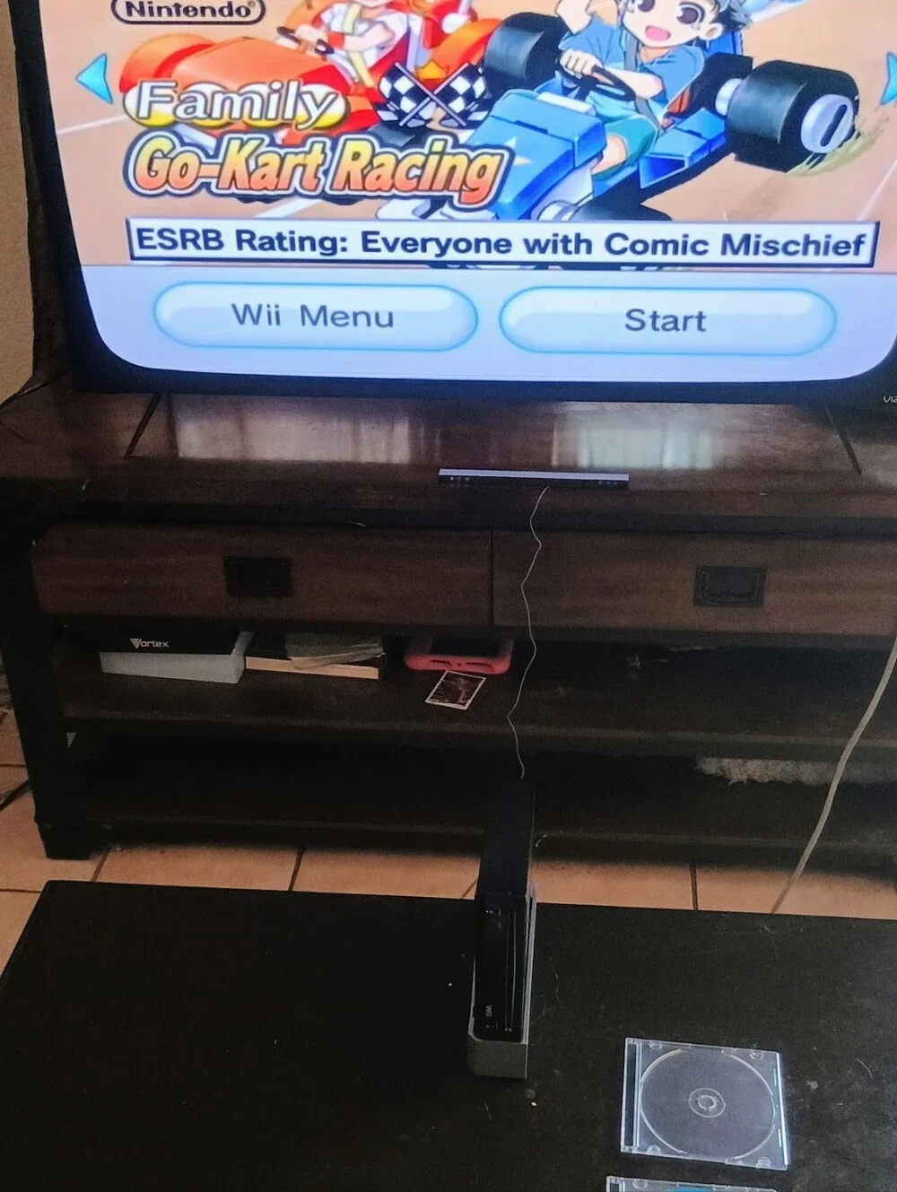 Nintendo Wii Bundle with 4 Games Black Console and White Controllers